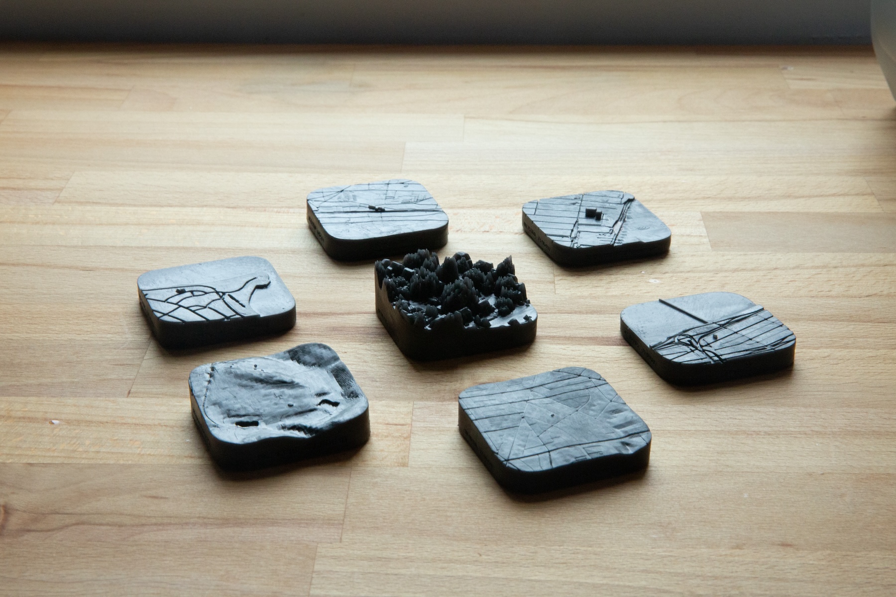 Seven prints organized in a hexagon