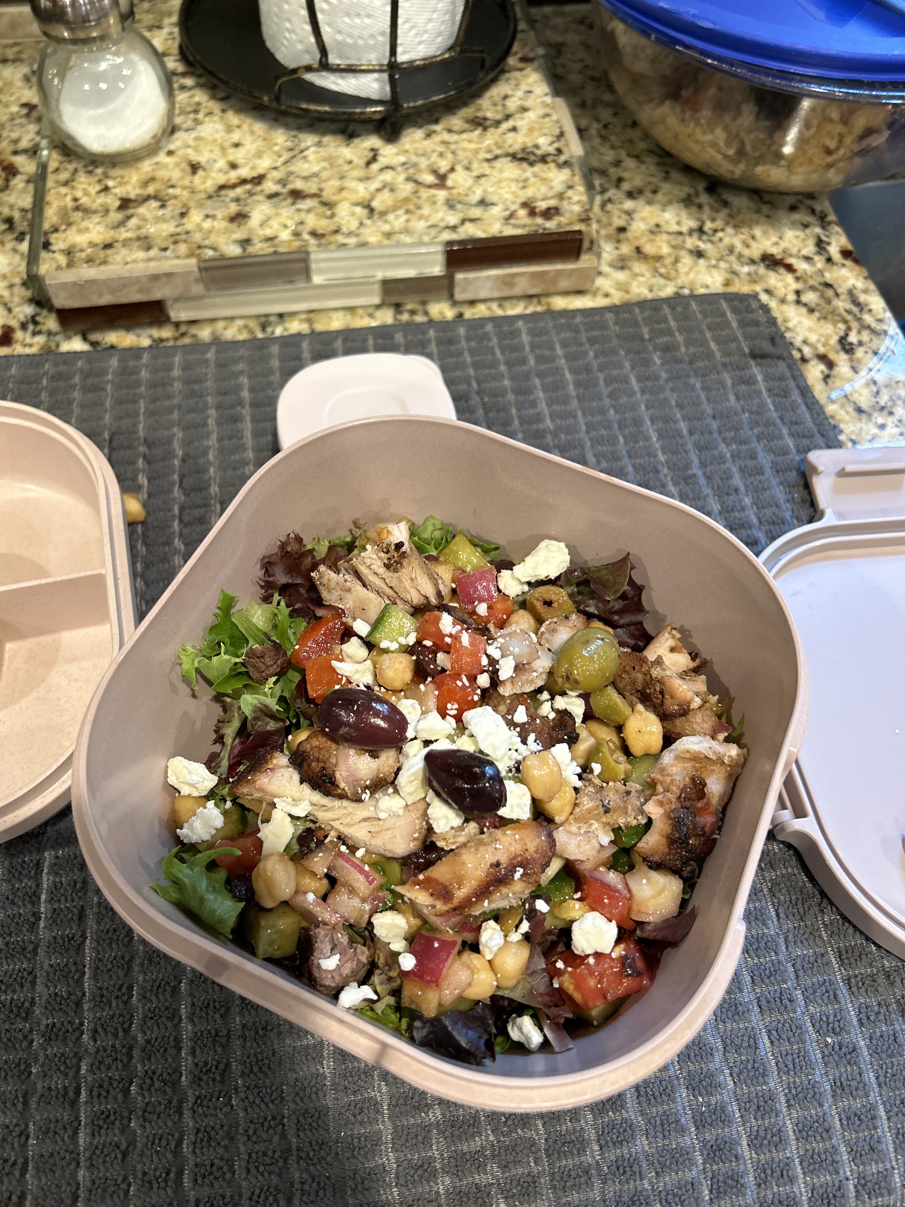 Salad in a neutral pink container